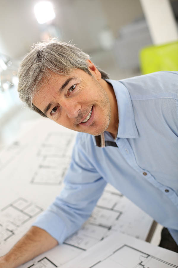 Portrait of smiling architect working in office