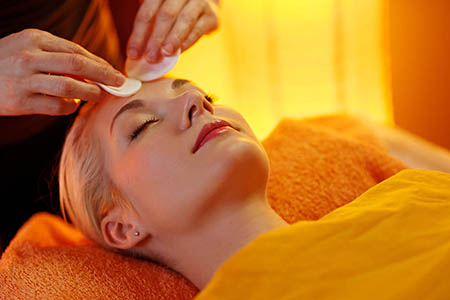 Beautiful woman having a face massage
