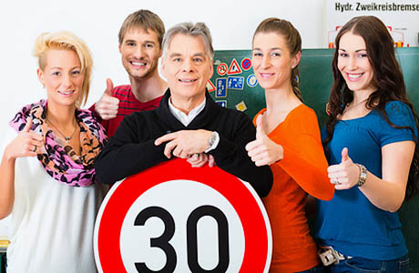 Driving instructor with his class