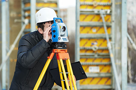 surveyor works with theodolite